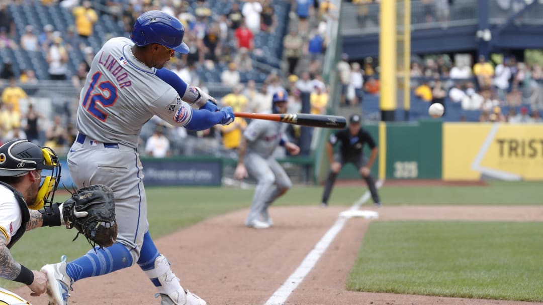 Jul 7, 2024; Pittsburgh, Pennsylvania, USA;  New York Mets shortstop Francisco Lindor (12) hits a game winning two run single against the Pittsburgh Pirates during the ninth inning at PNC Park. The Mets won 3-2.
