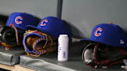 Apr 3, 2019; Atlanta, GA, USA; Detailed view of Chicago Cubs hats and gloves in the dugout against the Atlanta Braves in the fifth inning at SunTrust Park. Mandatory Credit: Brett Davis-Imagn Images
