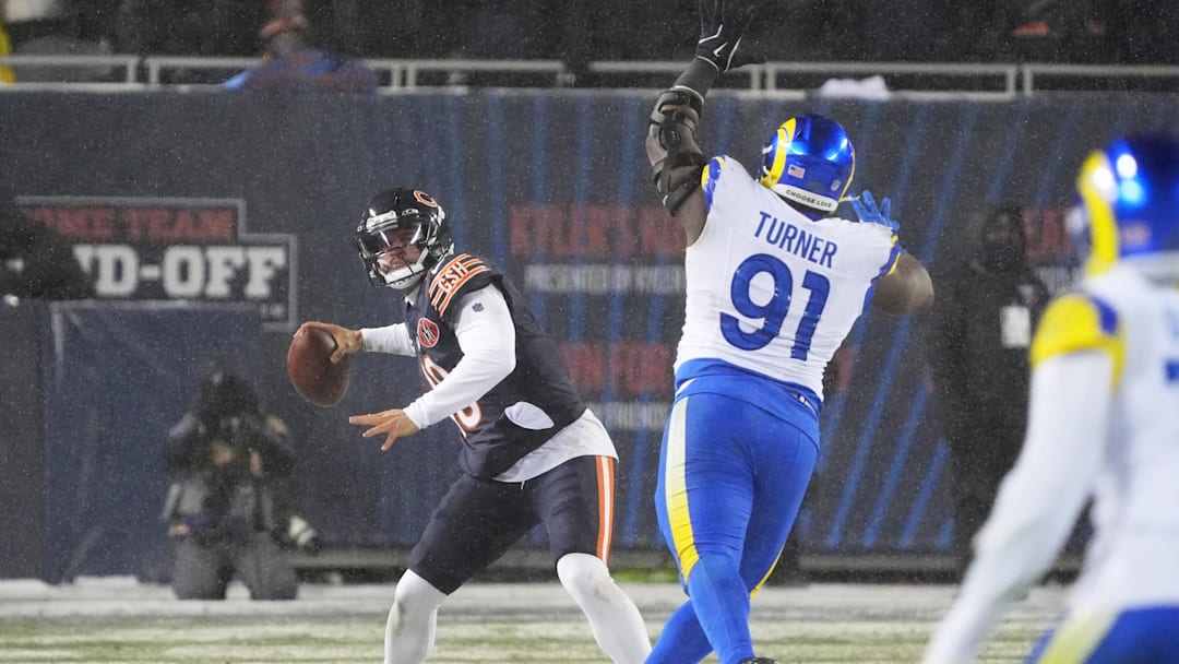 Jan 18, 2026; Chicago, IL, USA; Chicago Bears quarterback Caleb Williams (18) throws a pass against Los Angeles Rams defensive end Kobie Turner (91) during the third quarter of an NFC Divisional Round game at Soldier Field. Mandatory Credit: David Banks-Imagn Images