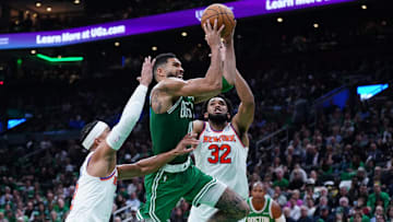 Oct 22, 2024; Boston, Massachusetts, USA; Boston Celtics forward Jayson Tatum (0) drives to the basket against New York Knicks center Karl-Anthony Towns (32) in the second quarter at TD Garden. Mandatory Credit: David Butler II-Imagn Images