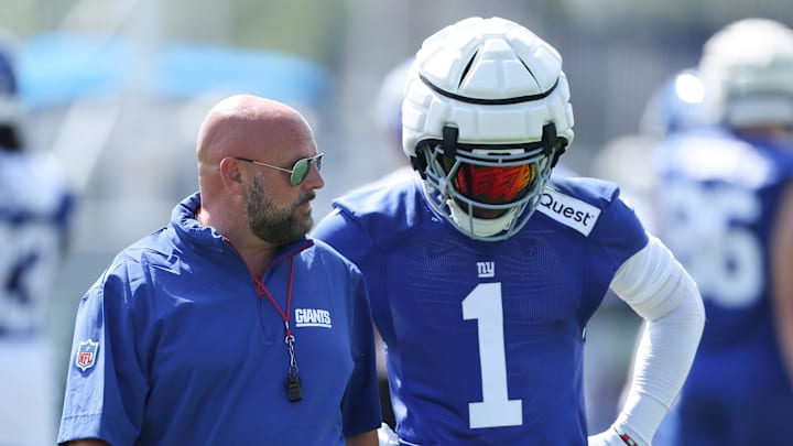 Jul 24, 2025; East Rutherford, NJ, USA; New York Giants head coach Brian Daboll talks with wide receiver Malik Nabers (1) during training camp at Quest Diagnostics Training Center. Mandatory Credit: Vincent Carchietta-Imagn Images