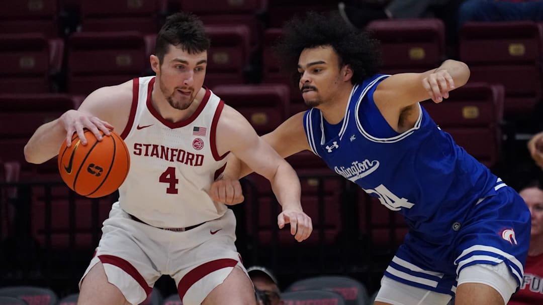 Dec 17, 2025; Stanford, California, USA;  Stanford Cardinal forward AJ Rohosy (4) posts up Texas-Arlington Mavericks forward/center Cameron Jackson (34) in the first half at Maples Pavilion. Mandatory Credit: David Gonzales-Imagn Images