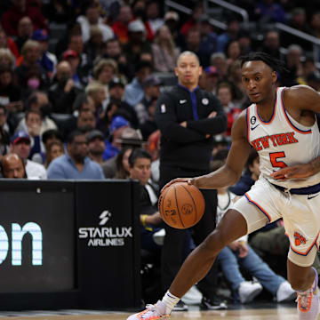 Mar 11, 2023; Los Angeles, California, USA;  New York Knicks guard Immanuel Quickley (5) dribbles the ball against Los Angeles Clippers forward Marcus Morris Sr. (8) during the second half at Crypto.com Arena. Mandatory Credit: Kiyoshi Mio-Imagn Images