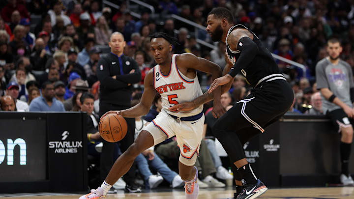 Mar 11, 2023; Los Angeles, California, USA;  New York Knicks guard Immanuel Quickley (5) dribbles the ball against Los Angeles Clippers forward Marcus Morris Sr. (8) during the second half at Crypto.com Arena. Mandatory Credit: Kiyoshi Mio-Imagn Images