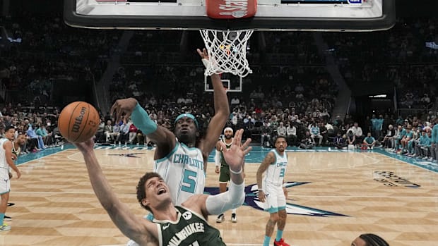 Charlotte Hornets Center Mark Williams (5) blocks a shot by Milwaukee Bucks Center Brook Lopez