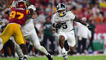 Sep 20, 2025; Los Angeles, California, USA; Michigan State Spartans running back Makhi Frazier (5) runs the ball against the Southern California Trojans during the second half at the Los Angeles Memorial Coliseum. Mandatory Credit: Gary A. Vasquez-Imagn Images