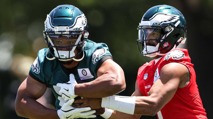 May 30, 2024; Philadelphia, PA, USA; Philadelphia Eagles quarterback Jalen Hurts (1) hands off to running back Saquon Barkley (26) during practice at NovaCare Complex. Mandatory Credit: Bill Streicher-USA TODAY Sports May 30, 2024; Philadelphia, PA, USA; Philadelphia Eagles quarterback Jalen Hurts (1) hands off to running back Saquon Barkley (26) during practice at NovaCare Complex. Mandatory Credit: Bill Streicher-USA TODAY Sports