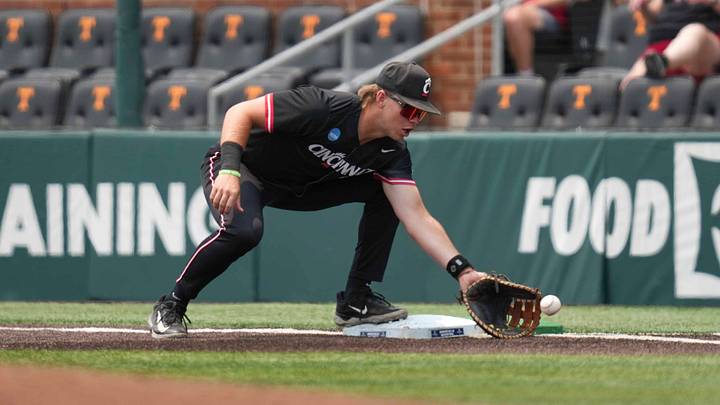Cincinnati infielder Quinton Coats (25) catches the ball during a NCAA regional baseball game between the Cincinnati Bearcats and Wake Forest Demon Deacons at Lindsey Nelson Stadium in Knoxville, Tenn., on June 1, 2025.