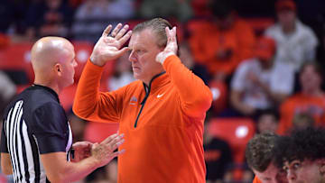 Nov 8, 2024; Champaign, Illinois, USA;  Illinois Fighting Illini head coach Brad Underwood talks with an official during the second half against the SIU Edwardsville Cougars at State Farm Center. Mandatory Credit: Ron Johnson-Imagn Images