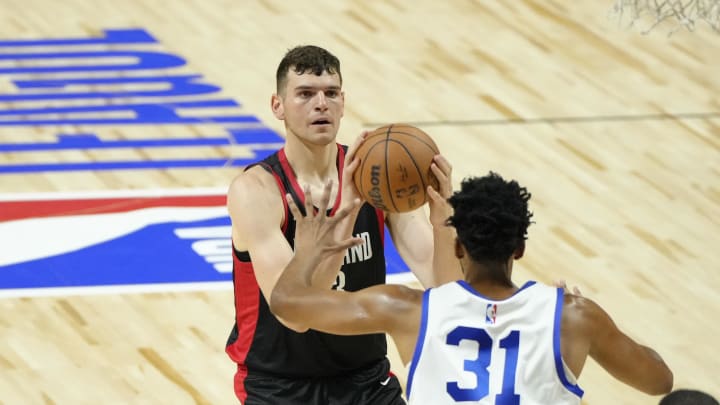 Jul 15, 2024; Las Vegas, NV, USA; Portland Trail Blazers center Donovan Clingan (23) shoots the ball against Philadelphia 76ers center Tony Bradley (31) during the first half at Thomas & Mack Center. Mandatory Credit: Lucas Peltier-USA TODAY Sports