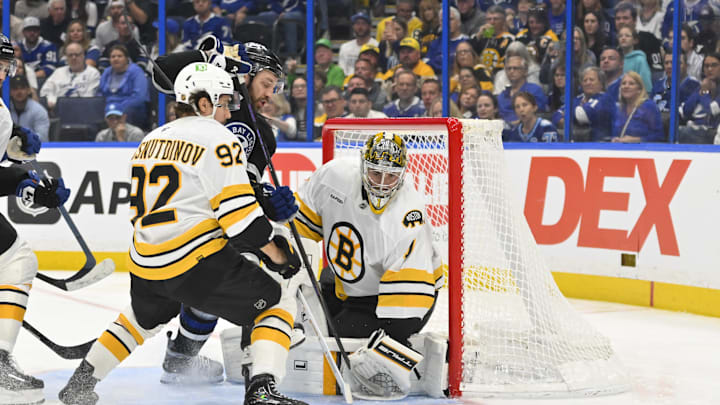 Apr 4, 2026; Tampa, Florida, USA; Tampa Bay Lightning center Zemgus Girgensons (28) attempts a goal during the third period against Boston Bruins center Marat Khusnutdinov (92) and goalie Jeremy Swayman (1) at Benchmark International Arena. Mandatory Credit: Pablo Robles-Imagn Images