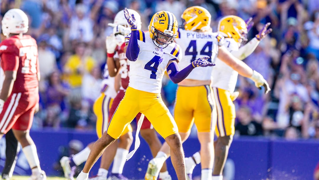 Nov 15, 2025; Baton Rouge, Louisiana, USA;  LSU Tigers cornerback Mansoor Delane (4) reacts to a stop on fourth down against the Arkansas Razorbacks during the second half at Tiger Stadium. Mandatory Credit: Stephen Lew-Imagn Images