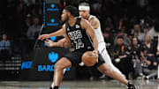 Oct 29, 2024; Brooklyn, New York, USA; Brooklyn Nets small guard Cam Thomas (24) dribbles the ball against Denver Nuggets small forward Michael Porter Jr. (1) during the first half at Barclays Center. Mandatory Credit: Gregory Fisher-Imagn Images