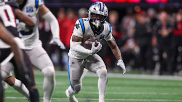 Jan 5, 2025; Atlanta, Georgia, USA; Carolina Panthers running back Miles Sanders (6) runs the ball against the Atlanta Falcons in the third quarter at Mercedes-Benz Stadium. Mandatory Credit: Brett Davis-Imagn Images