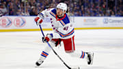 Feb 22, 2025; Buffalo, New York, USA;  New York Rangers defenseman Ryan Lindgren (55) takes a shot on goal during the first period against the Buffalo Sabres at KeyBank Center. Mandatory Credit: Timothy T. Ludwig-Imagn Images