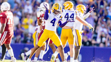 Nov 15, 2025; Baton Rouge, Louisiana, USA;  LSU Tigers cornerback Mansoor Delane (4) reacts to a stop on fourth down against the Arkansas Razorbacks during the second half at Tiger Stadium.