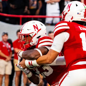 Sep 7, 2024; Lincoln, Nebraska, USA; Nebraska Cornhuskers quarterback Dylan Raiola (15) hands the ball off to running back Dante Dowdell (23) for a touchdown run against the Colorado Buffaloes during the second quarter at Memorial Stadium.