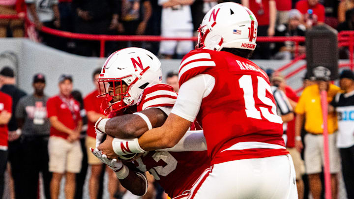 Sep 7, 2024; Lincoln, Nebraska, USA; Nebraska Cornhuskers quarterback Dylan Raiola (15) hands the ball off to running back Dante Dowdell (23) for a touchdown run against the Colorado Buffaloes during the second quarter at Memorial Stadium.