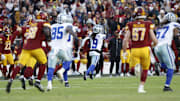 Dallas Cowboys wide receiver KaVontae Turpin returns a kickoff for a touchdown against the Washington Commanders during the fourth quarter at Northwest Stadium. 