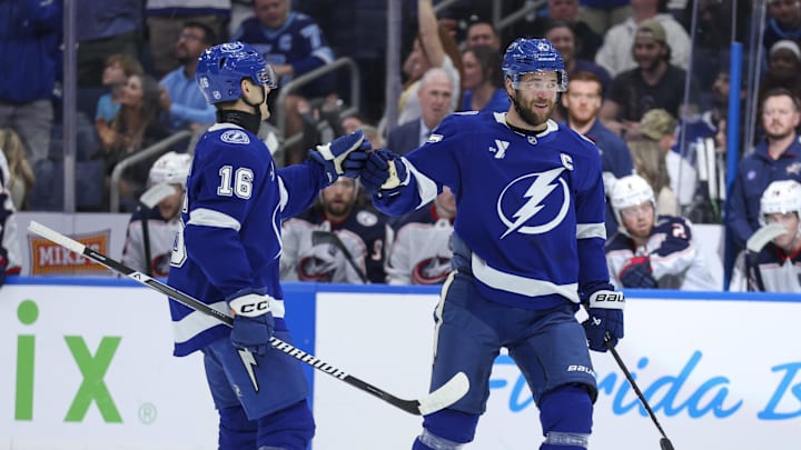 Mar 10, 2026; Tampa, Florida, USA; Tampa Bay Lightning defenseman Victor Hedman (77) and defenseman Steve Santini (16) react to an assist on a goal against the Columbus Blue Jackets in the first period at Benchmark International Arena. Mandatory Credit: Nathan Ray Seebeck-Imagn Images