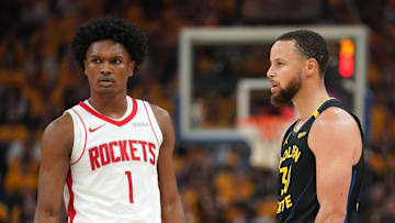May 2, 2025; San Francisco, California, USA; Houston Rockets forward Amen Thompson (1) stands next to Golden State Warriors guard Stephen Curry (30) during a break in the action in the second quarter of game six of the first round for the 2025 NBA Playoffs at Chase Center. Mandatory Credit: Cary Edmondson-Imagn Images