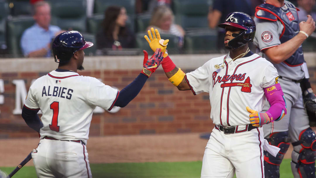 Sep 22, 2025; Atlanta, Georgia, USA; Atlanta Braves right fielder Ronald Acuna Jr. (13) celebrates with second baseman Ozzie Albies (1) after a home run against the Washington Nationals in the first inning at Truist Park. Mandatory Credit: Brett Davis-Imagn Images
Sep 22, 2025; Atlanta, Georgia, USA; Atlanta Braves right fielder Ronald Acuna Jr. (13) celebrates with second baseman Ozzie Albies (1) after a home run against the Washington Nationals in the first inning at Truist Park. Mandatory Credit: Brett Davis-Imagn Images