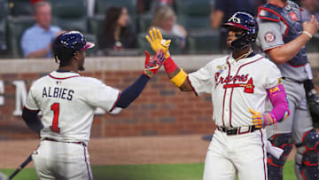 Sep 22, 2025; Atlanta, Georgia, USA; Atlanta Braves right fielder Ronald Acuna Jr. (13) celebrates with second baseman Ozzie Albies (1) after a home run against the Washington Nationals in the first inning at Truist Park. Mandatory Credit: Brett Davis-Imagn Images
