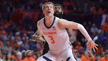 Nov 13, 2024; Champaign, Illinois, USA;  Illinois Fighting Illini forward Ben Humrichous (3) blocks Oakland Golden Grizzlies forward Buru Naivalurua (12) during the second half at State Farm Center. Mandatory Credit: Ron Johnson-Imagn Images