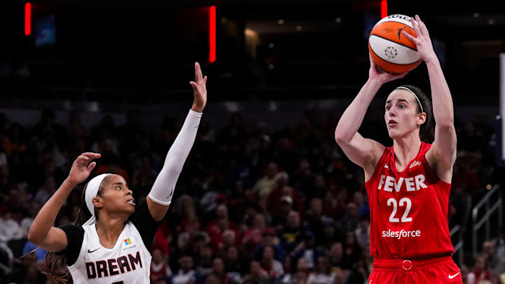 Indiana Fever guard Caitlin Clark (22) shoots a 3-pointer Sunday, Sept. 8, 2024, during a game between the Indiana Fever and the Atlanta Dream at Gainbridge Fieldhouse in Indianapolis. The Fever defeated the Dream in overtime, 104-100.