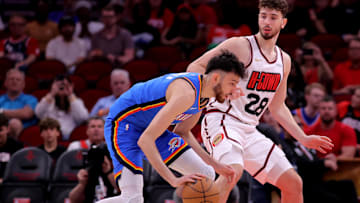 Apr 4, 2025; Houston, Texas, USA; Oklahoma City Thunder forward Chet Holmgren (7) handles the ball against Houston Rockets center Alperen Sengun (28) during the first quarter at Toyota Center. Mandatory Credit: Erik Williams-Imagn Images