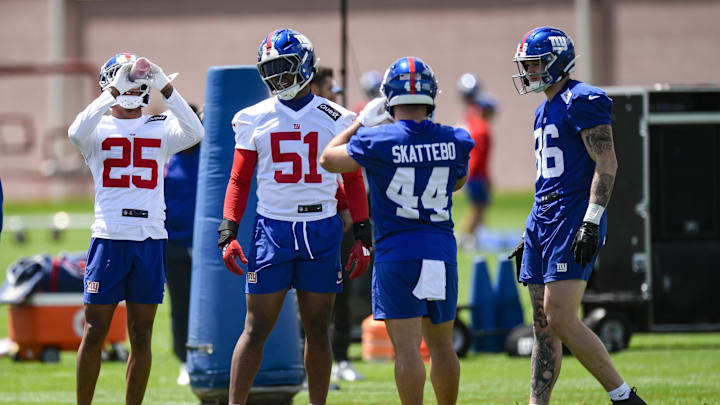 New York Giants' Korie Black, Abdul Carter, running back Cam Skattebo and Thomas Fidone II chat during NFL rookie minicamp
