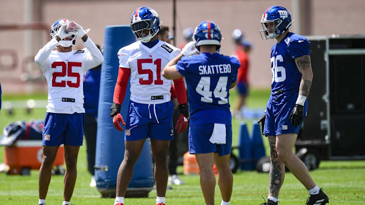 May 10, 2025; East Rutherford, NJ, USA; New York Giants cornerback Korie Black (25), linebacker Abdul Carter (51), running back Cam Skattebo (44) and tight end Thomas Fidone II (86) chat during rookie minicamp at Quest Diagnostics Training Center. Mandatory Credit: John Jones-Imagn Images