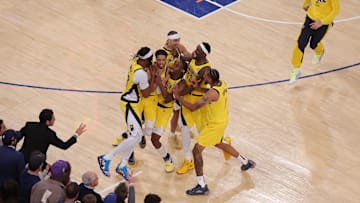 Indiana Pacers guard Tyrese Haliburton celebrates with teammates after tying the game in the fourth quarter to send the game to overtime against the New York Knicks.