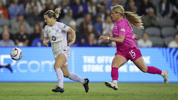 Racing Louisville FC defender Lauren Milliet (2) defends the ball against San Diego Wave FC forward Makenzy Doniak (15) during the second half at Lynn Family Stadium
