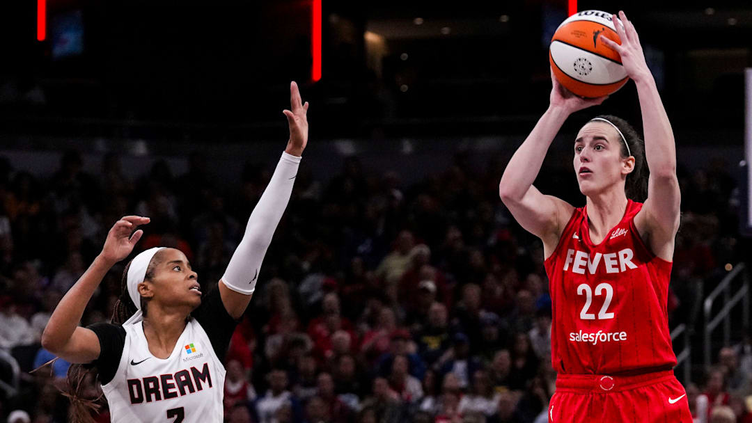 Indiana Fever guard Caitlin Clark (22) shoots a 3-pointer Sunday, Sept. 8, 2024, during a game between the Indiana Fever and the Atlanta Dream at Gainbridge Fieldhouse in Indianapolis. The Fever defeated the Dream in overtime, 104-100.