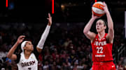 Indiana Fever guard Caitlin Clark (22) shoots a 3-pointer Sunday, Sept. 8, 2024, during a game between the Indiana Fever and the Atlanta Dream at Gainbridge Fieldhouse in Indianapolis. The Fever defeated the Dream in overtime, 104-100.