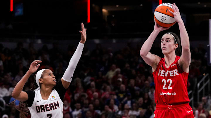 Indiana Fever guard Caitlin Clark (22) shoots a 3-pointer Sunday, Sept. 8, 2024, during a game between the Indiana Fever and the Atlanta Dream at Gainbridge Fieldhouse in Indianapolis. The Fever defeated the Dream in overtime, 104-100.