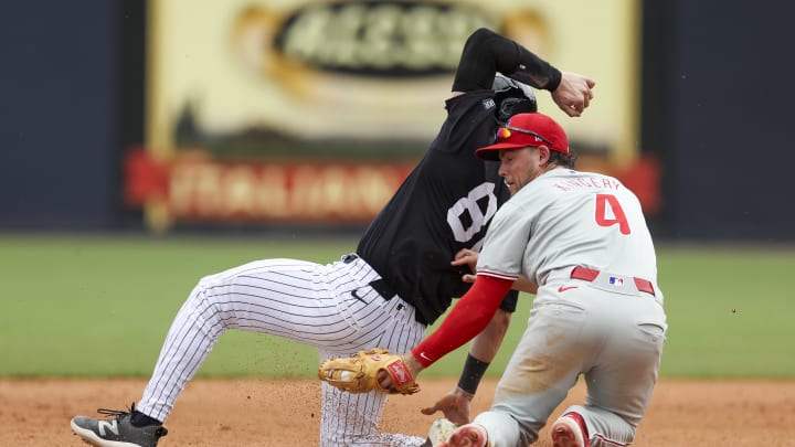 Mar 18, 2024; Tampa, Florida, USA;  New York Yankees catcher Austin Wells (88) is caught stealing by Philadelphia Phillies shortstop Scott Kingery (4) in the fourth inning at George M. Steinbrenner Field.