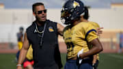 Eastwood head football coach Julio Lopez talks to his player Jude Walker at practice on Wednesday, Aug. 14, 2024.