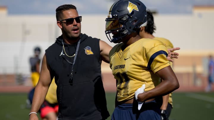 Eastwood head football coach Julio Lopez talks to his player Jude Walker at practice on Wednesday, Aug. 14, 2024.