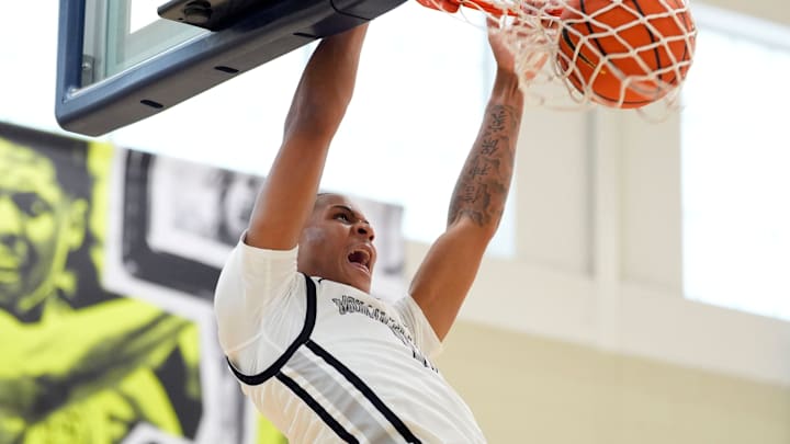 MoKan's Trent Perry (11) dunks the ball during a game at the Nike EYBL Peach Jam at Riverview Park Activities Center, in July.
