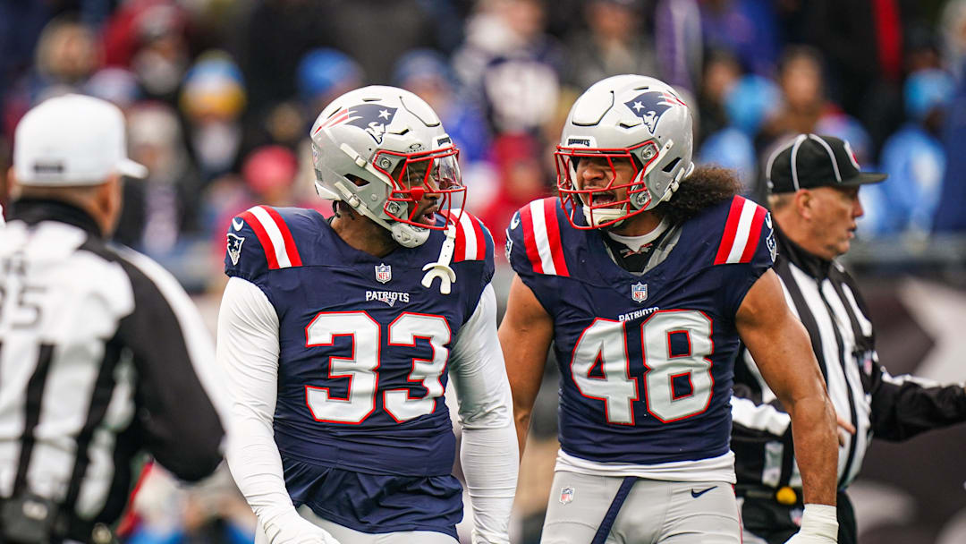 Dec 28, 2024; Foxborough, Massachusetts, USA; New England Patriots linebacker Anfernee Jennings (33) and linebacker Jahlani Tavai (48) react after a play against the Los Angeles Chargers in the first quarter at Gillette Stadium. Mandatory Credit: David Butler II-Imagn Images