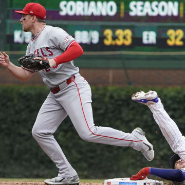 Jul 7, 2024; Chicago, Illinois, USA; Los Angeles Angels second base Brandon Drury (23) tags out Chicago Cubs catcher Miguel Amaya (9) out at second baseman during the third inning at Wrigley Field. Mandatory Credit: David Banks-USA TODAY Sports