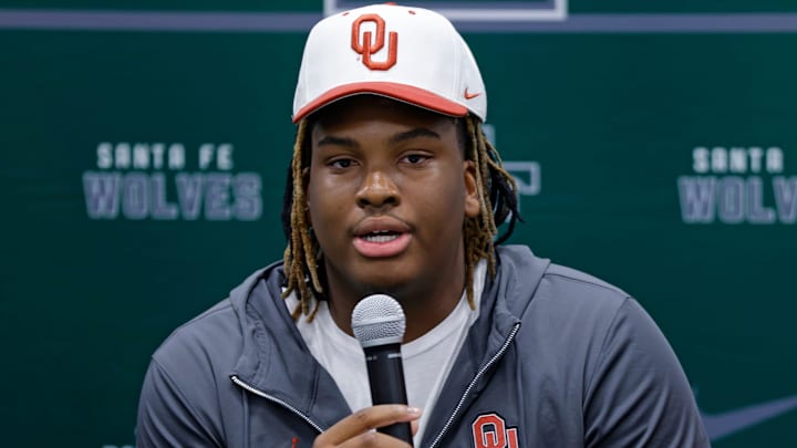 Edmond Santa Fe's Josh Aisosa speaks before signing to play football with OU during a signing day ceremony in Edmond, Wednesday, Dec. 20, 2023.