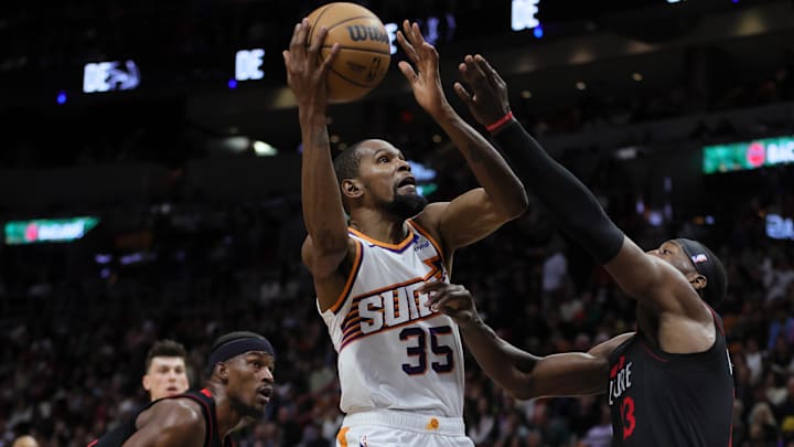 Jan 29, 2024; Miami, Florida, USA; Phoenix Suns forward Kevin Durant (35) drives to the basket against Miami Heat center Bam Adebayo (13) during the second quarter at Kaseya Center. Mandatory Credit: Sam Navarro-Imagn Images