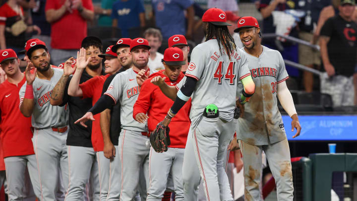 Jul 22, 2024; Atlanta, Georgia, USA; Cincinnati Reds shortstop Elly De La Cruz (44) and left fielder Will Benson (30) celebrate after a victory over the Atlanta Braves at Truist Park. Mandatory Credit: Brett Davis-USA TODAY Sports