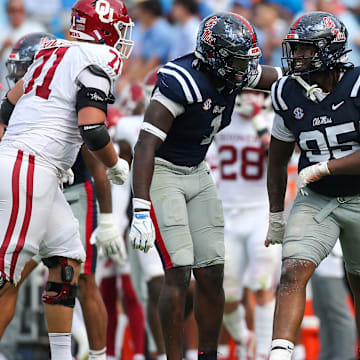 Oct 26, 2024; Oxford, Mississippi, USA; Mississippi Rebels defensive lineman Princely Umanmielen (1) and defensive lineman Akelo Stone (95) reacts after a sack during the second half  against the Oklahoma Sooners at Vaught-Hemingway Stadium. Mandatory Credit: Petre Thomas-Imagn Images