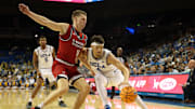 Nov 3, 2025; Los Angeles, California, USA;  UCLA Bruins guard Jamar Brown (4) dribbles the ball against Eastern Washington Eagles guard Straton Rogers (12) during the second half at Pauley Pavilion presented by Wescom Financial. Mandatory Credit: Kiyoshi Mio-Imagn Images