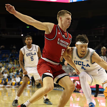 Nov 3, 2025; Los Angeles, California, USA;  UCLA Bruins guard Jamar Brown (4) dribbles the ball against Eastern Washington Eagles guard Straton Rogers (12) during the second half at Pauley Pavilion presented by Wescom Financial. Mandatory Credit: Kiyoshi Mio-Imagn Images
