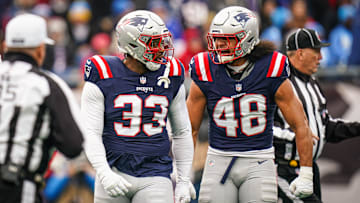New England Patriots linebacker Anfernee Jennings (33) and linebacker Jahlani Tavai (48) react after a play against the Los Angeles Chargers in the first quarter at Gillette Stadium.